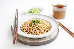 Closeup of Japanese Udon Noodles with Green Onions photo