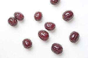 Close Up of Dates on White Background photo