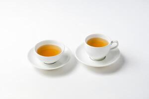 Two Cups of Tea on White Background photo