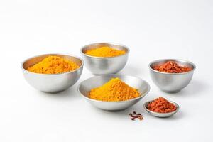 Turmeric and Chili Powder in Bowls on White Background photo