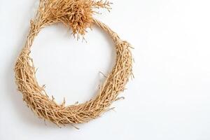 Dried Grass Wreath on White Background photo