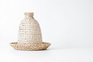 White wicker vase on white background photo