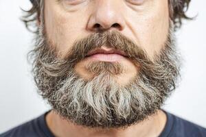 Close-up of a man's face with a full beard and mustache photo