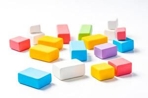 Colorful blocks scattered on a white background photo
