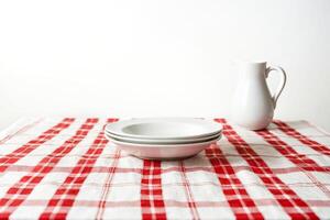 Empty Plate on Red and White Tablecloth photo