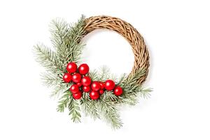 Christmas Wreath with Red Berries and Pine Needles photo