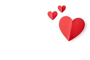 Red Paper Hearts on White Background photo