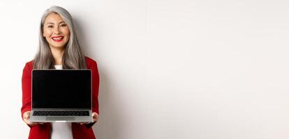 Business. Smiling asian businesswoman showing blank digital tablet screen, standing over white background photo