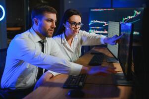Business team investment working with computer, planning and analyzing graph stock market trading with stock chart data photo