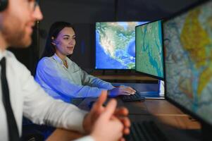 Diverse call center operators team use computers consulting clients in office photo