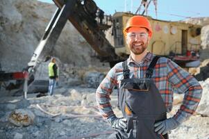 Worker and quarry in background photo