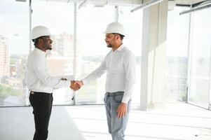 Group of multi ethnic engineer construction site worker meeting at workplace photo