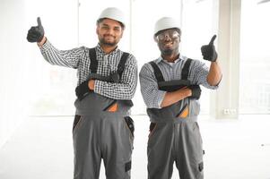 Group of multi ethnic engineer construction site worker meeting at workplace photo