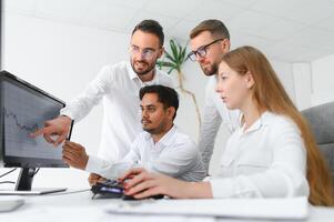 Business team working on their business project together at office. photo