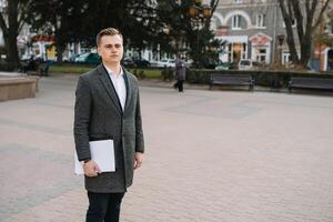 Young business man with documents. photo