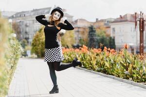 The girl with makeup of the mime. improvisation. mime shows different emotions photo