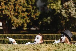 Street artists performing, Two mimes man and woman in april fools day photo