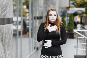 The girl with makeup of the mime. improvisation. mime shows different emotions photo