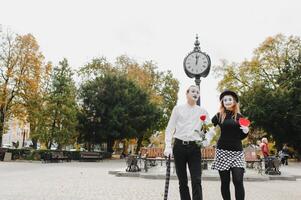 Mime on the street waiting to meet with his lover. Portrait of a mime comedian. mime on the street photo