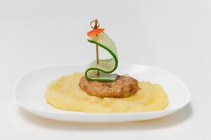mashed potatoes with cutlet. children's menu photo