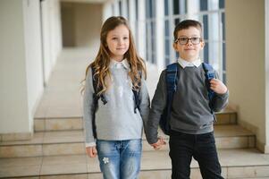 School kids in uniform together in corridor. Conception of education. photo