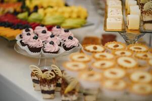 various dessert with fresh fruit on buffet line, sweet. photo