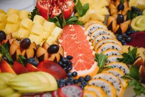 various dessert with fresh fruit on buffet line, sweet. photo