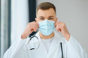 close up portrait of medical doctor in mask with copy space photo