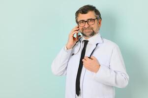 doctor ready to help patients with health problems, isolated on blue background with copy space photo