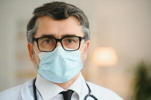 portrait of middle age doctor wearing protective mask. Corona virus concept. photo
