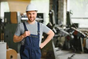 Factory worker. Man working on the production line. photo