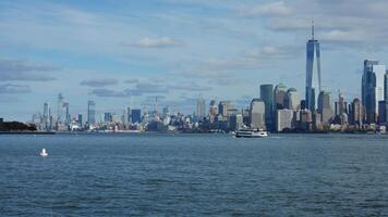 The New York manhattan view from the ferry boat in the sunny day photo