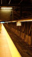 The city subway view with the old platform and lights on in the New York city photo