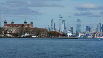 The New York manhattan view from the ferry boat in the sunny day photo