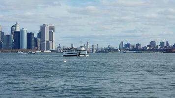 The New York manhattan view from the ferry boat in the sunny day photo