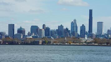 The New York manhattan view from the ferry boat in the sunny day photo