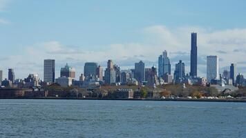 The New York manhattan view from the ferry boat in the sunny day photo