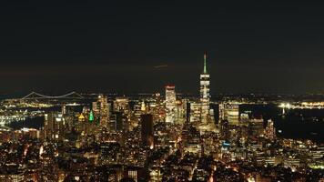 The New York city night view with the lights on in the skyscrapers at night photo