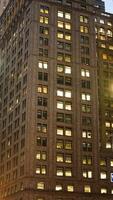 The New York city night view with the lights on in the skyscrapers at night photo