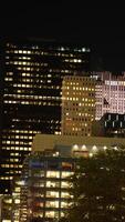 The New York city night view with the lights on in the skyscrapers at night photo