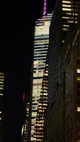 The New York city night view with the lights on in the skyscrapers at night photo