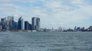 The New York manhattan view from the ferry boat in the sunny day photo
