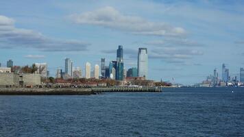 The New York manhattan view from the ferry boat in the sunny day photo