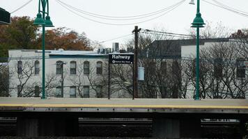 The train station view with the iron tracks near the platform photo