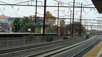 The train station view with the iron tracks near the platform photo