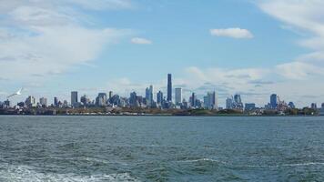 The New York manhattan view from the ferry boat in the sunny day photo