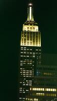 The New York city night view with the lights on in the skyscrapers at night photo