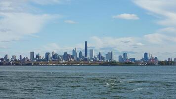 The New York manhattan view from the ferry boat in the sunny day photo