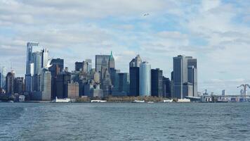 The New York manhattan view from the ferry boat in the sunny day photo
