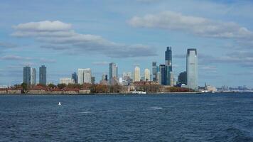 The New York manhattan view from the ferry boat in the sunny day photo